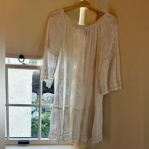 Boho chic white dress with embroidered paisley detail.